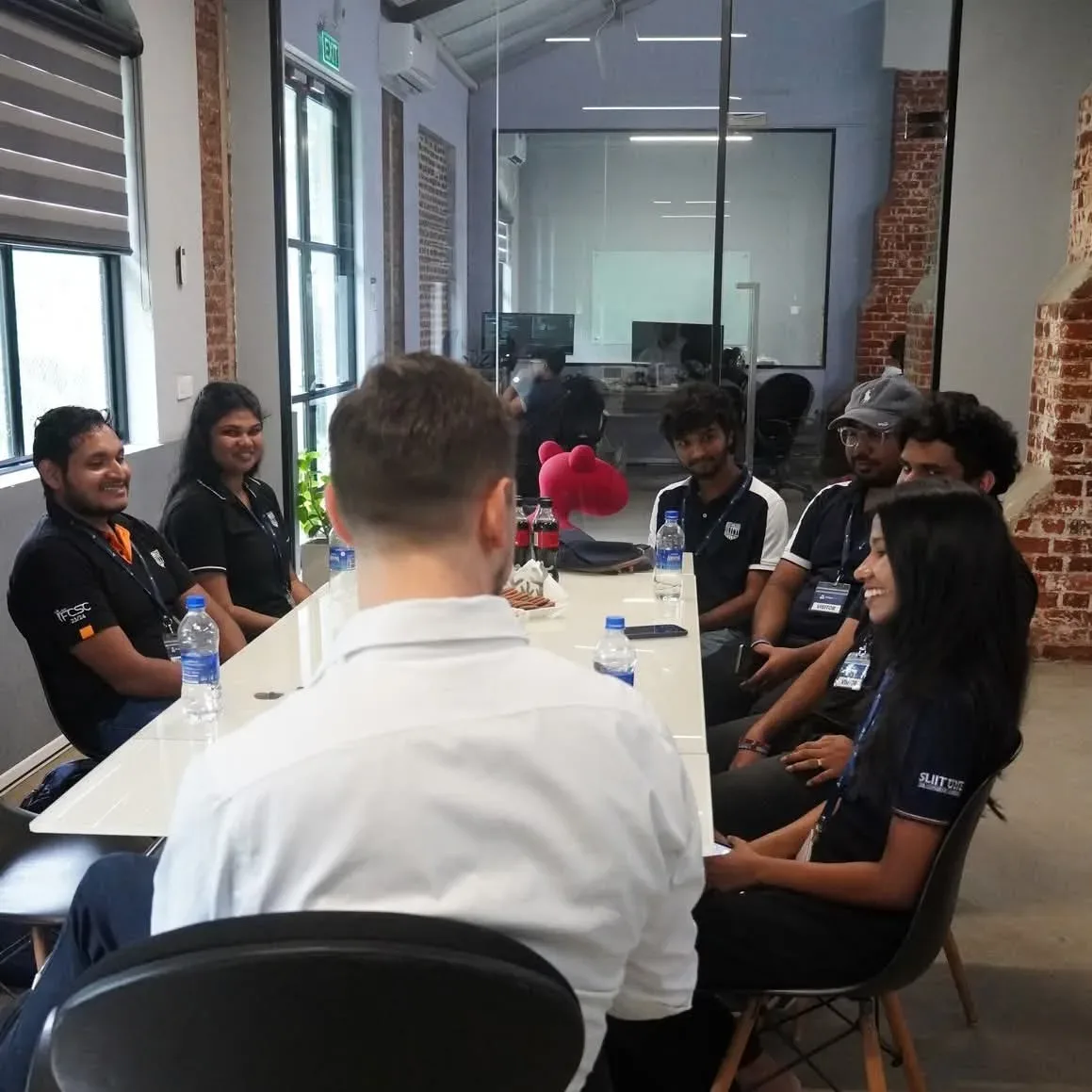 Team members sharing ideas around a table