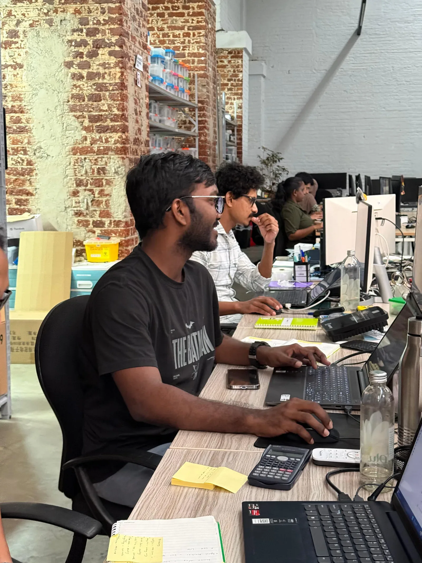 Atlas Labs colleagues collaborating at their desks
