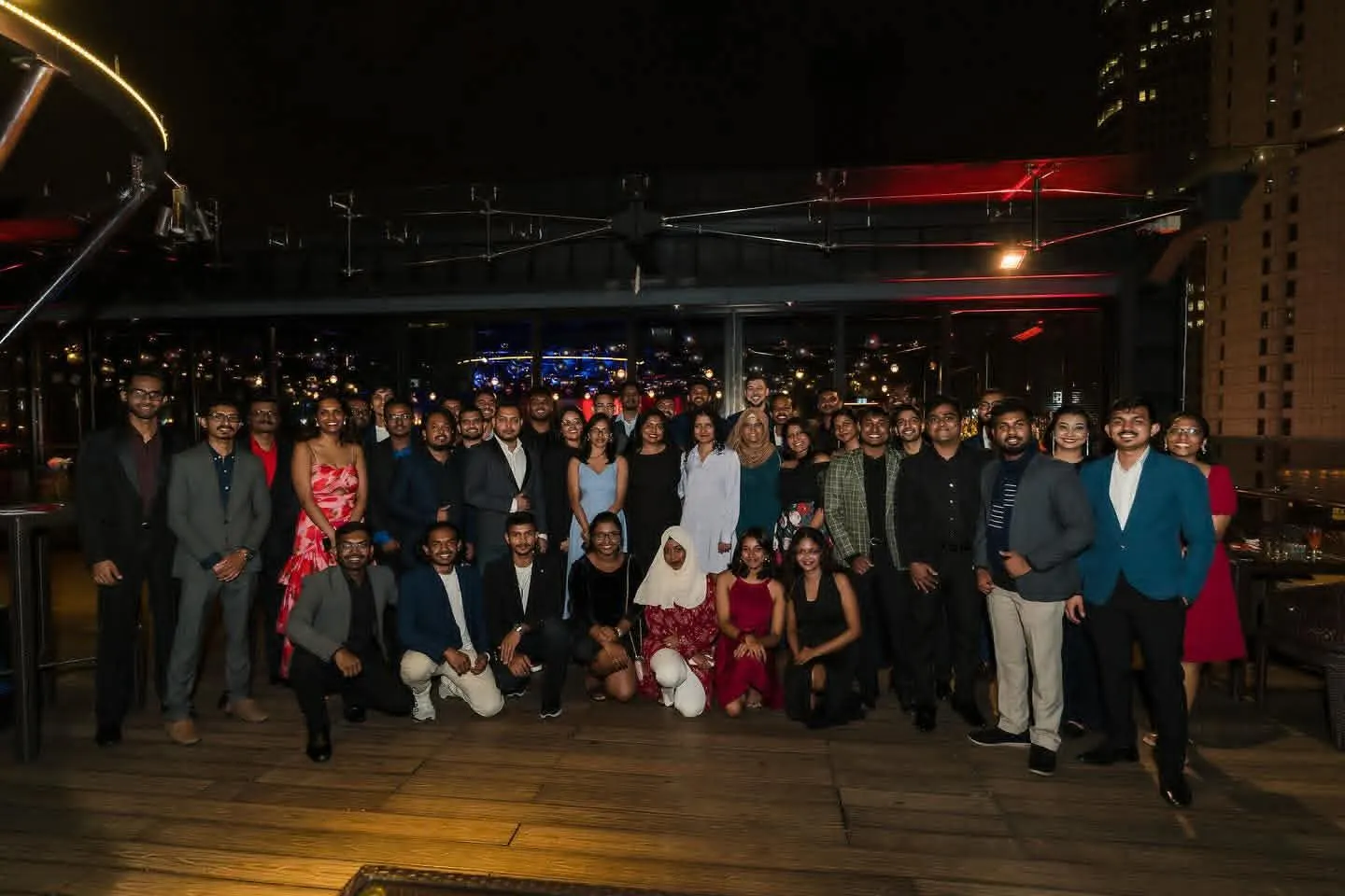 The team together at an evening celebration