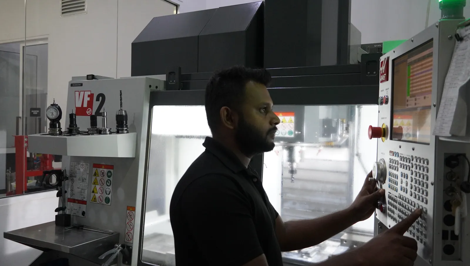 An engineer working with electronics equipment